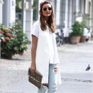 White top with white vest. Never worn